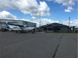 Plane in front of Nakina R. Elmer Ruddick Nakina Airport Terminal