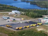 Terminal building with several planes on the ground